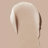 Creamy swatch of LIPSMART Hydrating Lip Treatment on a beige background, showcasing its smooth texture for hydrated lips.