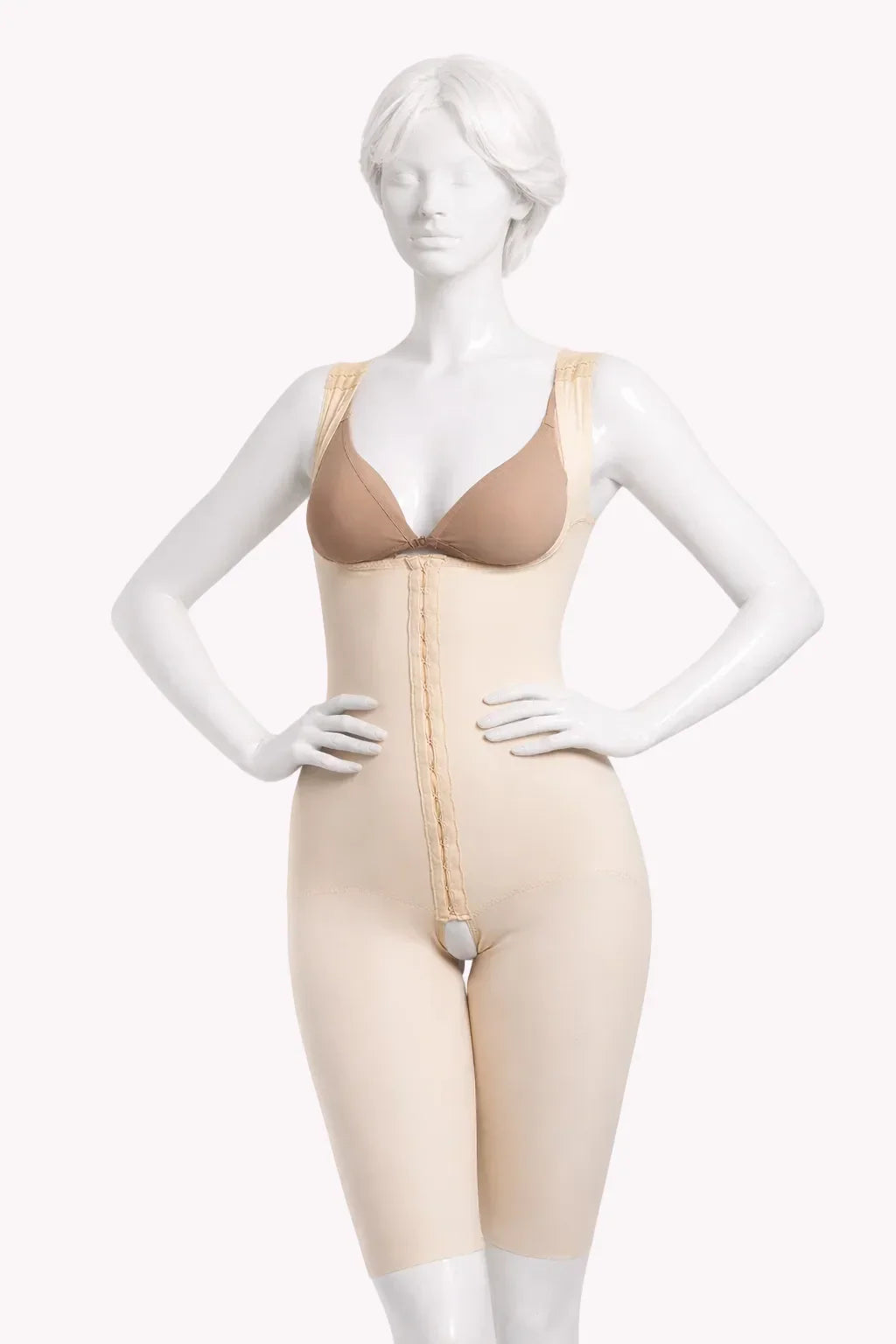 Mannequin wearing a beige shapewear bodysuit on a white background