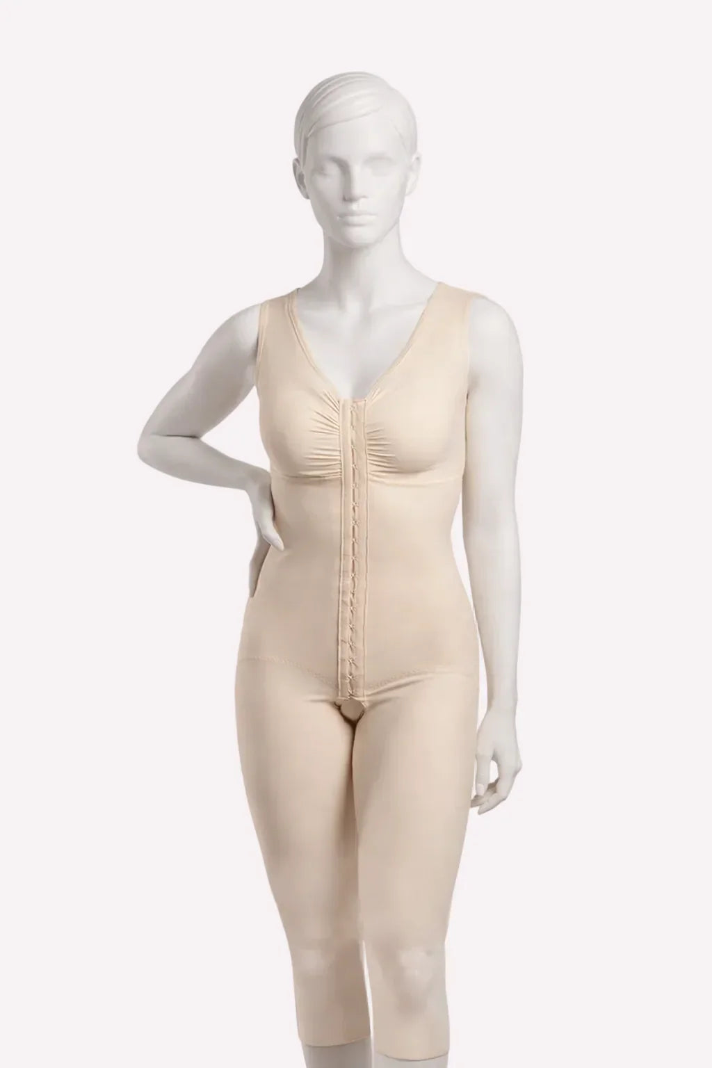 Beige bodysuit on a mannequin against a white background