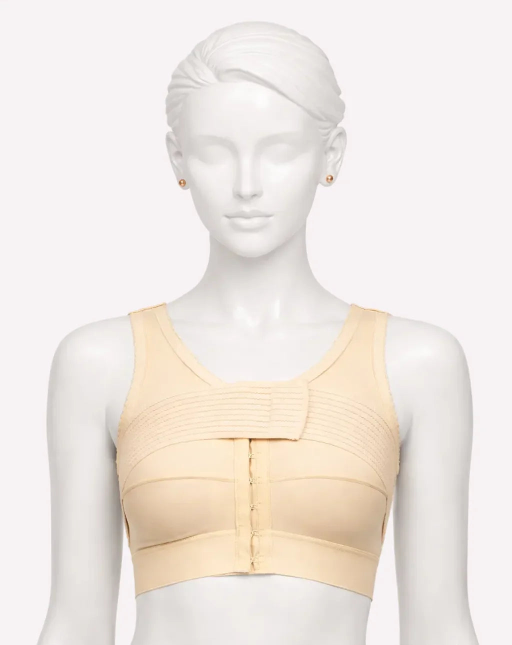Mannequin wearing a beige compression bra on a white background