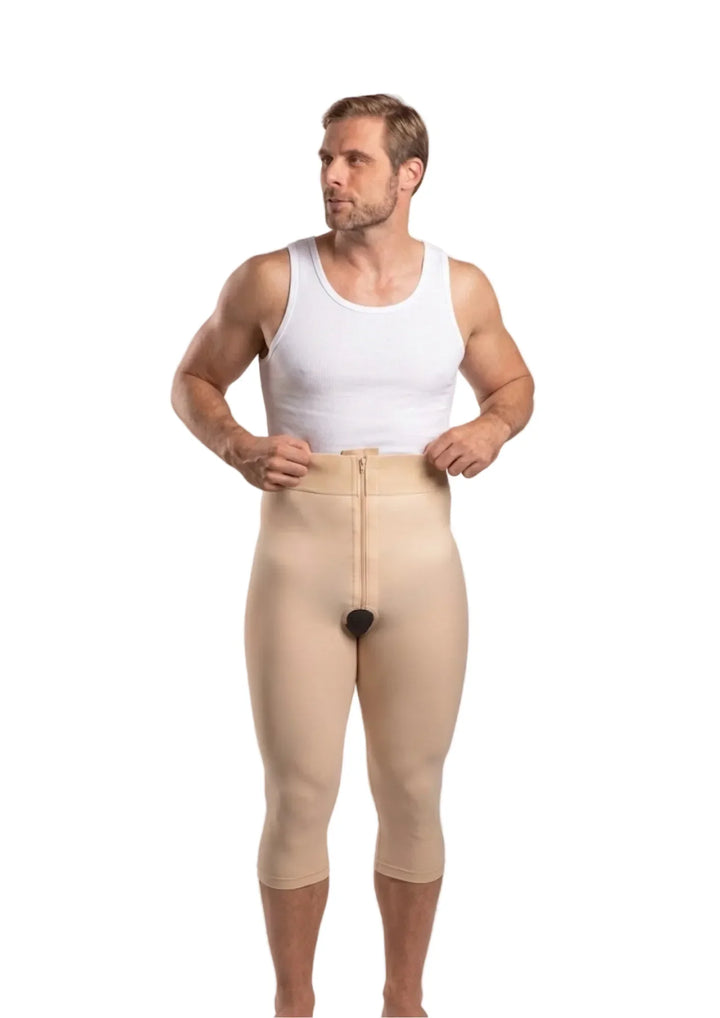 Man wearing beige compression pants with ISAVELA branding on a white background